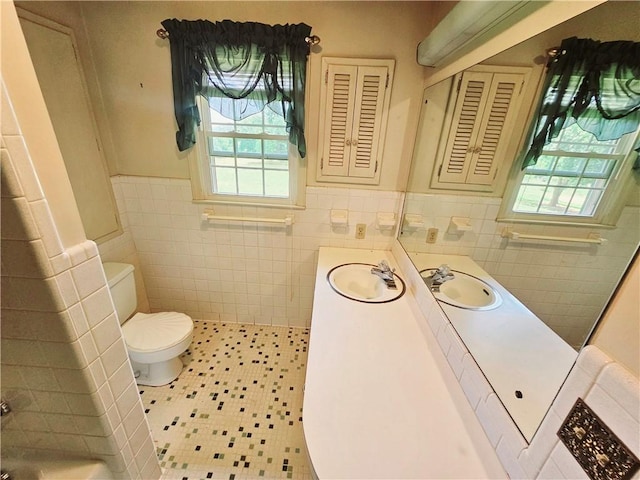 150 Prater Dr, Seneca, SC 29678 - bathroom featuring tile walls, healthy amount of natural light, wainscoting, tile patterned floors, and vanity