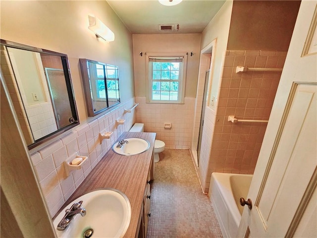 150 Prater Dr, Seneca, SC 29678 - full bath featuring tile walls, a shower with door, tile patterned flooring, a bathtub, and wainscoting