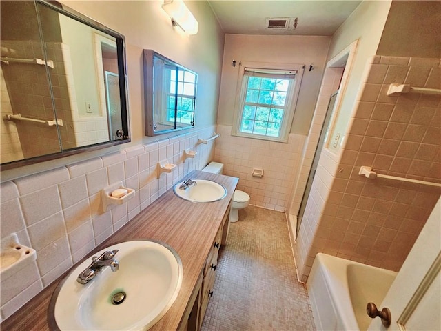 150 Prater Dr, Seneca, SC 29678 - bathroom with tile walls, an enclosed shower, wainscoting, tile patterned flooring, and a bath