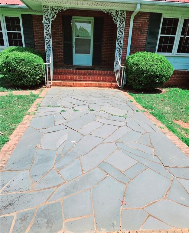 150 Prater Dr, Seneca, SC 29678 - property entrance with covered porch and brick siding