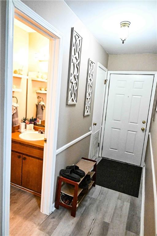 343 Old Greenville Hwy Unit 5, Clemson, SC 29631 - doorway to outside with wood finished floors and a sink