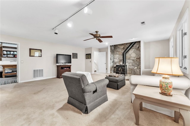 4 Slack Tide Ct, Salem, SC 29676 - living room with a wood stove, light carpet, track lighting, and a ceiling fan