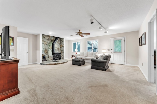 4 Slack Tide Ct, Salem, SC 29676 - living room with a wood stove, light carpet, a ceiling fan, and rail lighting