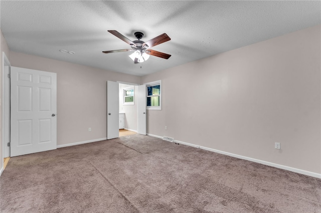 4214 Hembree Creek Rd, Anderson, SC 29625 - unfurnished bedroom featuring carpet, ensuite bath, a ceiling fan, and a textured ceiling