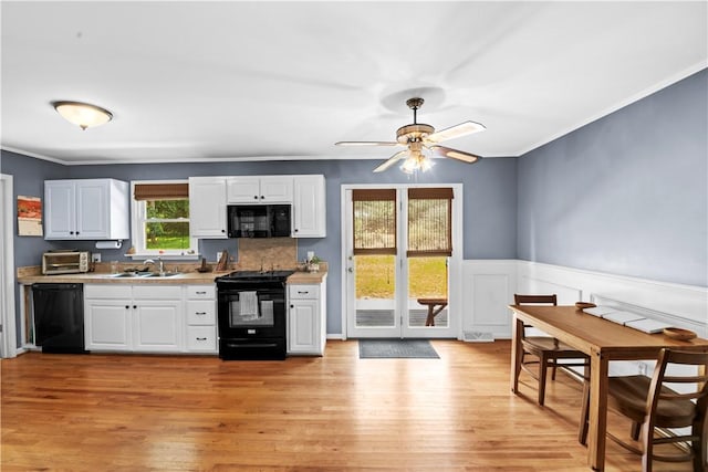 4 Grandview Rd, Travelers Rest, SC 29690 - kitchen with black appliances, light countertops, a ceiling fan, light wood-style floors, and crown molding