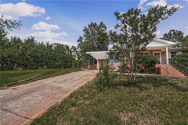 4 Grandview Rd, Travelers Rest, SC 29690 - view of front facade with driveway, brick siding, and a carport