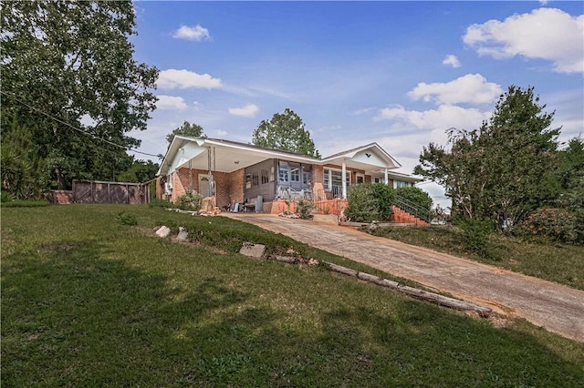 4 Grandview Rd, Travelers Rest, SC 29690 - rear view of house featuring driveway, a carport, a yard, and brick siding
