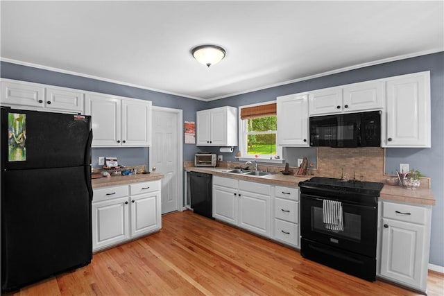 4 Grandview Rd, Travelers Rest, SC 29690 - kitchen featuring black appliances, light countertops, white cabinets, and crown molding