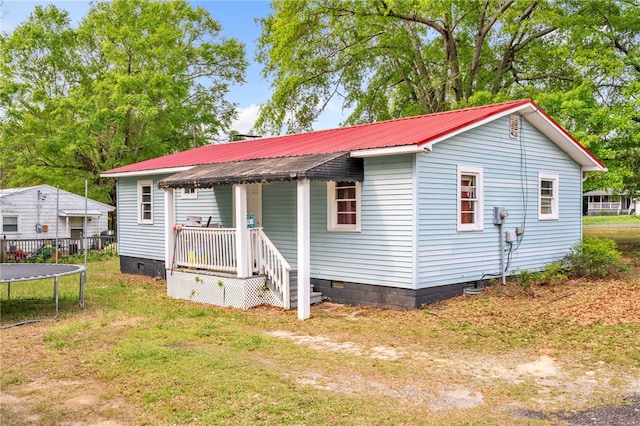 805 Cooley Bridge Rd, Pelzer, SC 29669 - view of front of property featuring crawl space, covered porch, a trampoline, and a metal roof