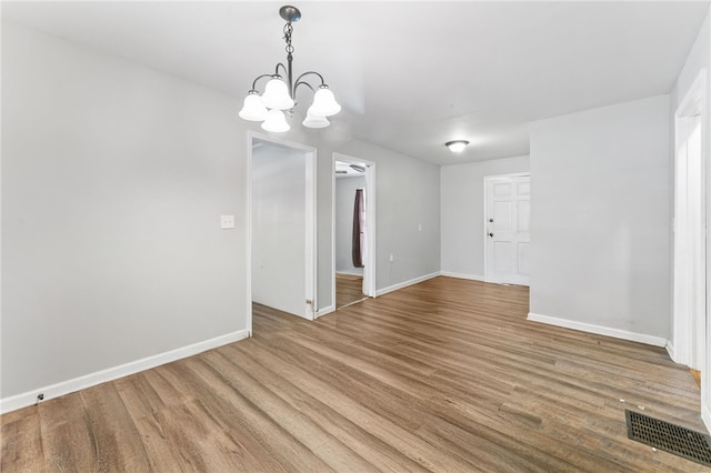 805 Cooley Bridge Rd, Pelzer, SC 29669 - empty room featuring wood finished floors and a chandelier
