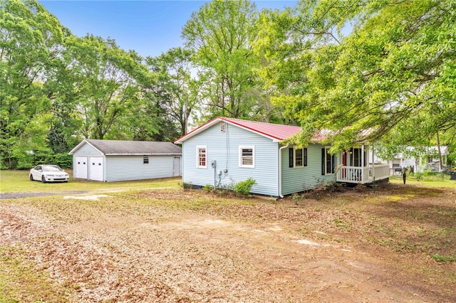 805 Cooley Bridge Rd, Pelzer, SC 29669 - view of home's exterior featuring a detached garage, an outbuilding, and a metal roof