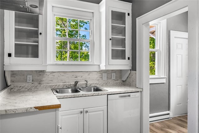 104 W Franklin St, Anderson, SC 29624 - kitchen with dishwashing machine, a baseboard heating unit, plenty of natural light, and glass insert cabinets