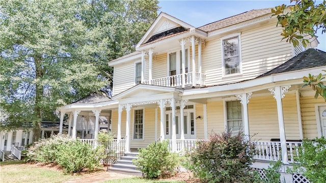 200 W N 1st St, Seneca, SC 29678 - neoclassical home featuring covered porch, roof with shingles, and a balcony