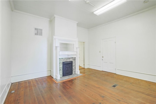 200 W N 1st St, Seneca, SC 29678 - unfurnished living room featuring hardwood / wood-style flooring, crown molding, and a tiled fireplace