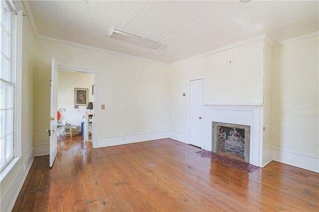 200 W N 1st St, Seneca, SC 29678 - unfurnished living room featuring wood-type flooring, a fireplace with flush hearth, and ornamental molding