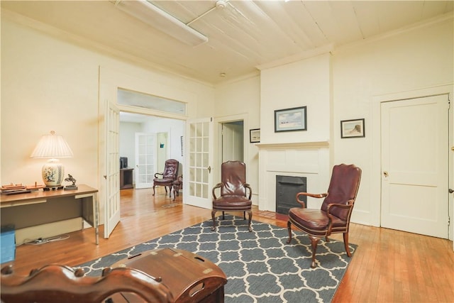 200 W N 1st St, Seneca, SC 29678 - living room featuring crown molding, hardwood / wood-style flooring, french doors, and a glass covered fireplace