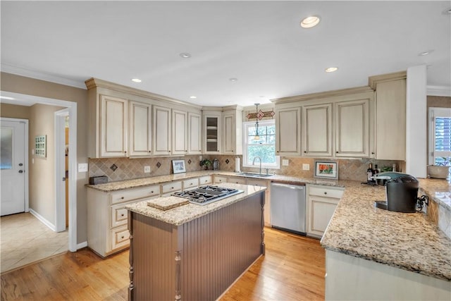 105 Wren Crossing Ct, Easley, SC 29642 - kitchen featuring stainless steel dishwasher, gas stovetop, crown molding, cream cabinets, and backsplash