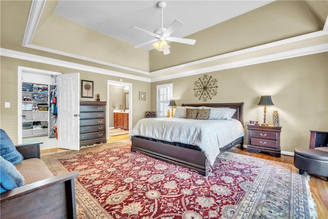 105 Wren Crossing Ct, Easley, SC 29642 - bedroom featuring wood finished floors, a walk in closet, ornamental molding, ensuite bath, and a closet