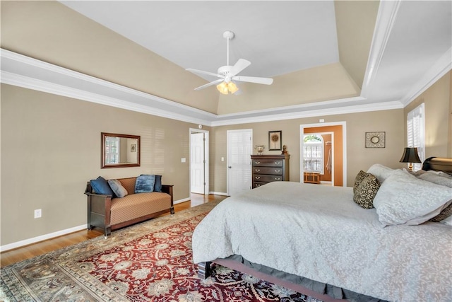105 Wren Crossing Ct, Easley, SC 29642 - bedroom featuring a tray ceiling, wood finished floors, ornamental molding, and a ceiling fan