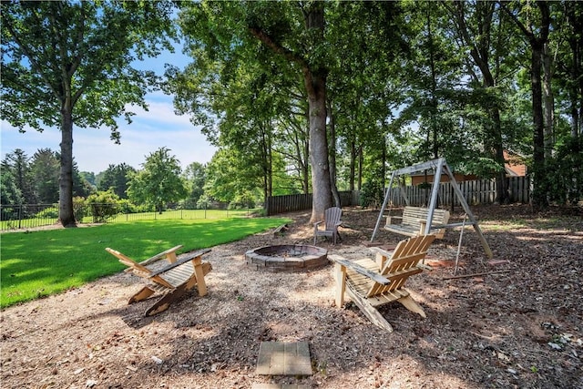 105 Wren Crossing Ct, Easley, SC 29642 - fenced backyard with an outdoor fire pit and view of wooded area