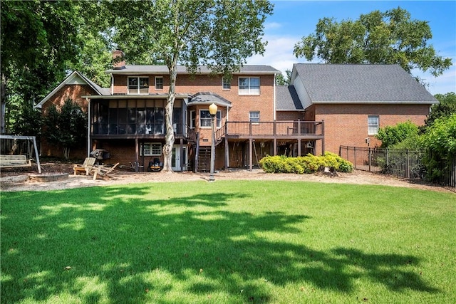 105 Wren Crossing Ct, Easley, SC 29642 - back of property with a sunroom, a chimney, a deck, brick siding, and stairs