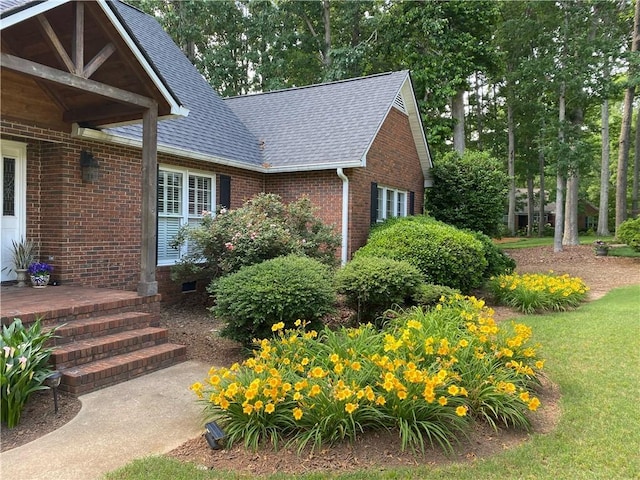 105 Wren Crossing Ct, Easley, SC 29642 - view of side of property featuring roof with shingles, brick siding, and a lawn