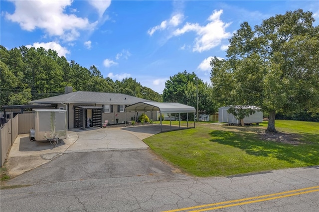 701 Durham Brown Rd, Seneca, SC 29678 - view of front of house featuring driveway, a storage unit, and a detached carport