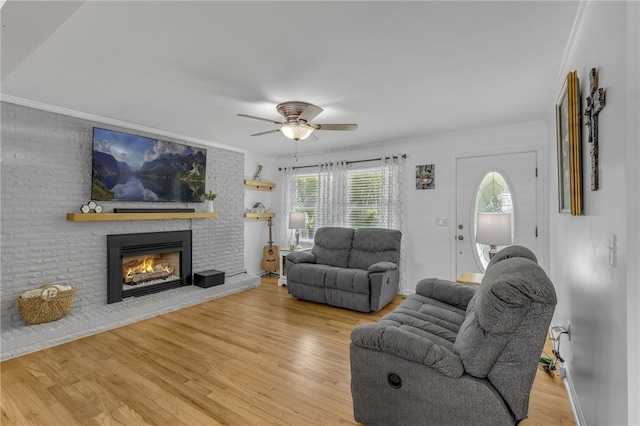 701 Durham Brown Rd, Seneca, SC 29678 - living area featuring ornamental molding, ceiling fan, a fireplace, and wood finished floors