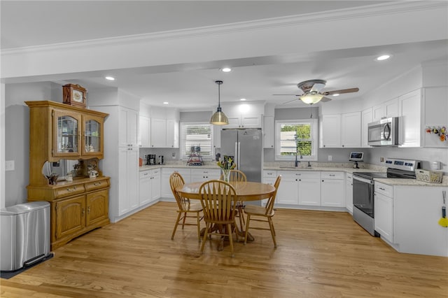 701 Durham Brown Rd, Seneca, SC 29678 - kitchen featuring appliances with stainless steel finishes, white cabinetry, light wood-style flooring, recessed lighting, and a ceiling fan