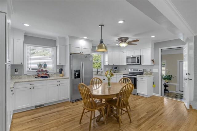 701 Durham Brown Rd, Seneca, SC 29678 - kitchen with appliances with stainless steel finishes, white cabinetry, ceiling fan, light wood finished floors, and recessed lighting