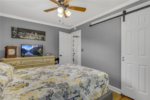 701 Durham Brown Rd, Seneca, SC 29678 - bedroom with a barn door, crown molding, wood finished floors, and a ceiling fan