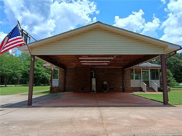 412 Bishop Branch Rd, Pendleton, SC 29670 - view of car parking with water heater, driveway, a carport, and entry steps