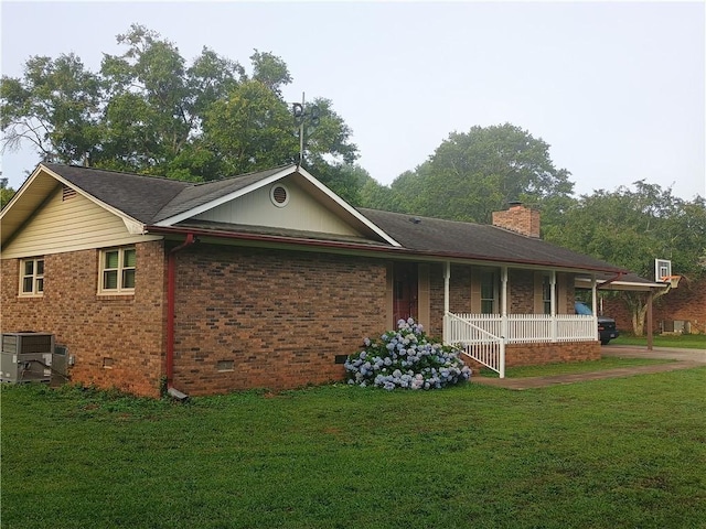 412 Bishop Branch Rd, Pendleton, SC 29670 - view of home's exterior with covered porch, a yard, crawl space, and brick siding