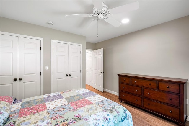 122 Downs Blvd, Clemson, SC 29631 - bedroom with two closets, light wood-style floors, and ceiling fan