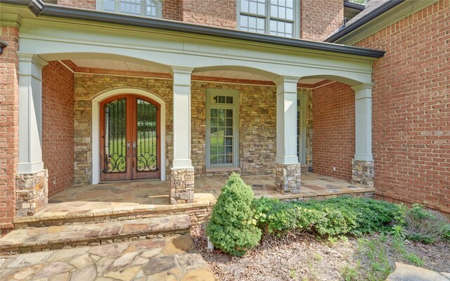 210 Rosewood Cir, Hartwell, GA 30643 - doorway to property featuring a porch and brick siding