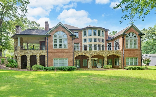 210 Rosewood Cir, Hartwell, GA 30643 - back of house with a yard, a balcony, a chimney, brick siding, and stone siding