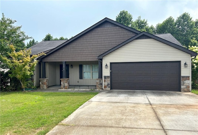 1016 Sand Palm Way, Anderson, SC 29621 - view of front facade with stone siding, concrete driveway, a front lawn, and a garage