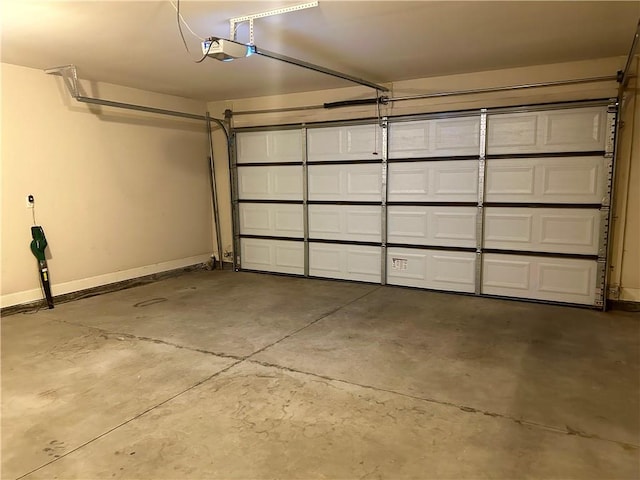 1016 Sand Palm Way, Anderson, SC 29621 - garage featuring a garage door opener and baseboards