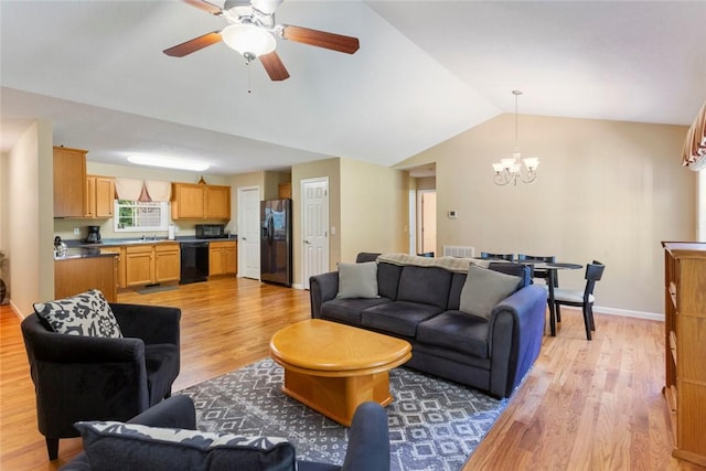 518 Pecan Grove Rd, Seneca, SC 29672 - living area featuring a chandelier, light wood-style flooring, vaulted ceiling, and a ceiling fan