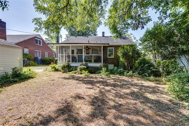 118 Glenwood Ave, Anderson, SC 29625 - rear view of house featuring brick siding and a sunroom