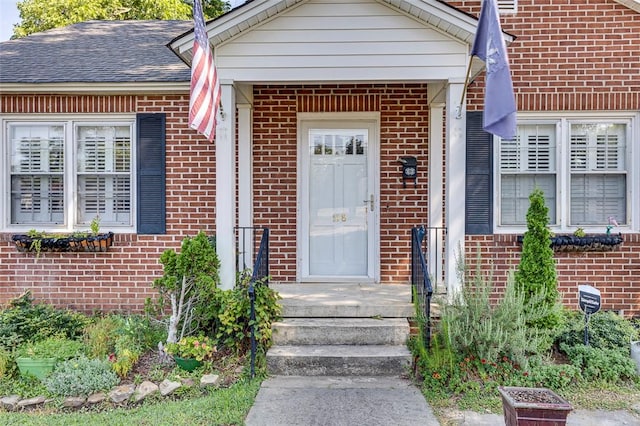 118 Glenwood Ave, Anderson, SC 29625 - doorway to property featuring brick siding and roof with shingles