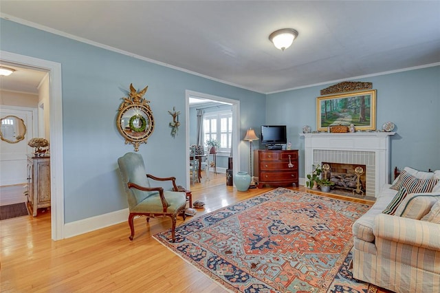 118 Glenwood Ave, Anderson, SC 29625 - living area featuring crown molding, wood finished floors, and a brick fireplace