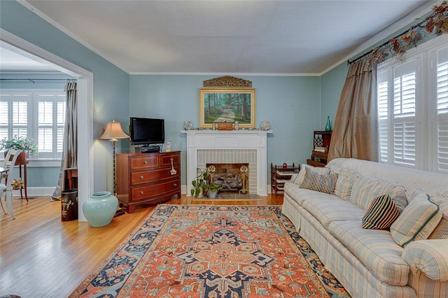 118 Glenwood Ave, Anderson, SC 29625 - living area with wood finished floors, crown molding, and a brick fireplace