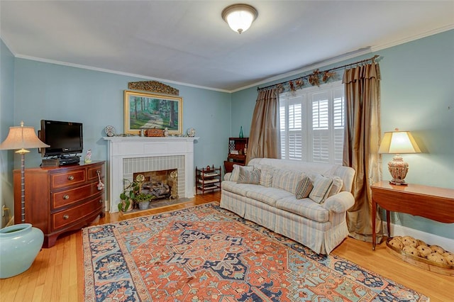 118 Glenwood Ave, Anderson, SC 29625 - living room featuring wood finished floors, a fireplace with flush hearth, and ornamental molding