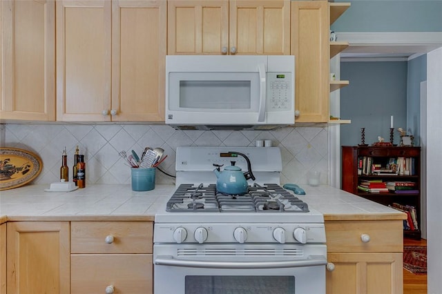118 Glenwood Ave, Anderson, SC 29625 - kitchen featuring white appliances, tile counters, light brown cabinetry, and decorative backsplash