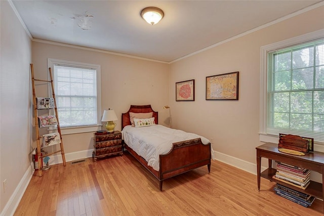 118 Glenwood Ave, Anderson, SC 29625 - bedroom featuring light wood-style flooring, multiple windows, and ornamental molding
