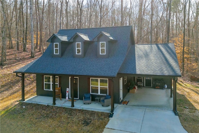 112 Choestoea Rd, Westminster, SC 29693 - view of front of house featuring concrete driveway, roof with shingles, a carport, and a forest view