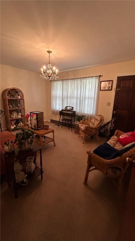 1202 Fairhaven Dr, Anderson, SC 29626 - carpeted living area with a chandelier and a baseboard radiator