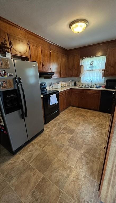 1202 Fairhaven Dr, Anderson, SC 29626 - kitchen with stainless steel fridge, black / electric stove, under cabinet range hood, and light countertops