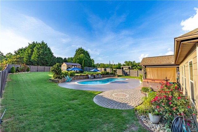 2444 Poole Rd, Greer, SC 29650 - view of swimming pool with a fenced backyard, a storage unit, and a patio area